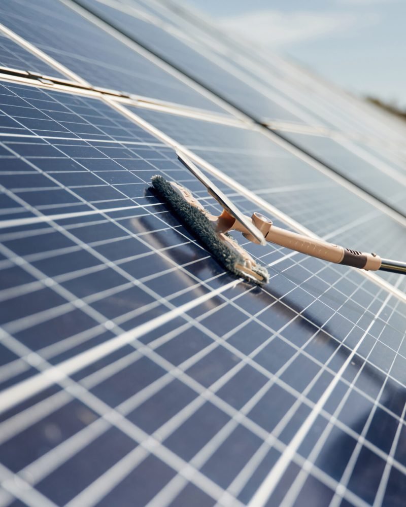 Close up view of cleaning solar panels surface.